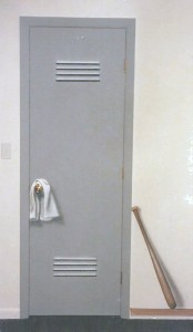 Trompe l'oeil mural by Paul Barker of locker room door, towel on doorknob, baseball bat
