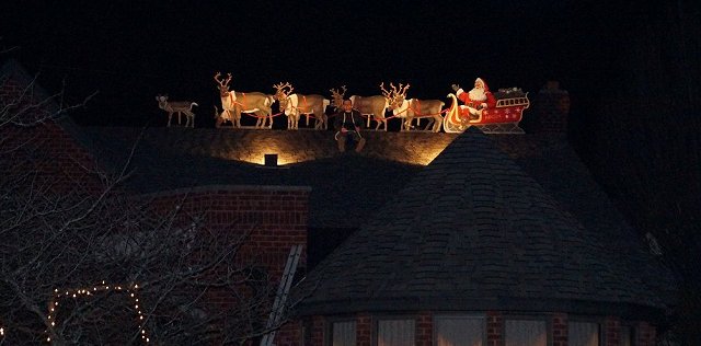 santa and reindeer roof decoration