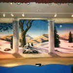 Christmas stage scenery set painted by muralist Paul Barker of Googleplex