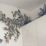 Mural of plants above residential kitchen cupboards by Paul Barker